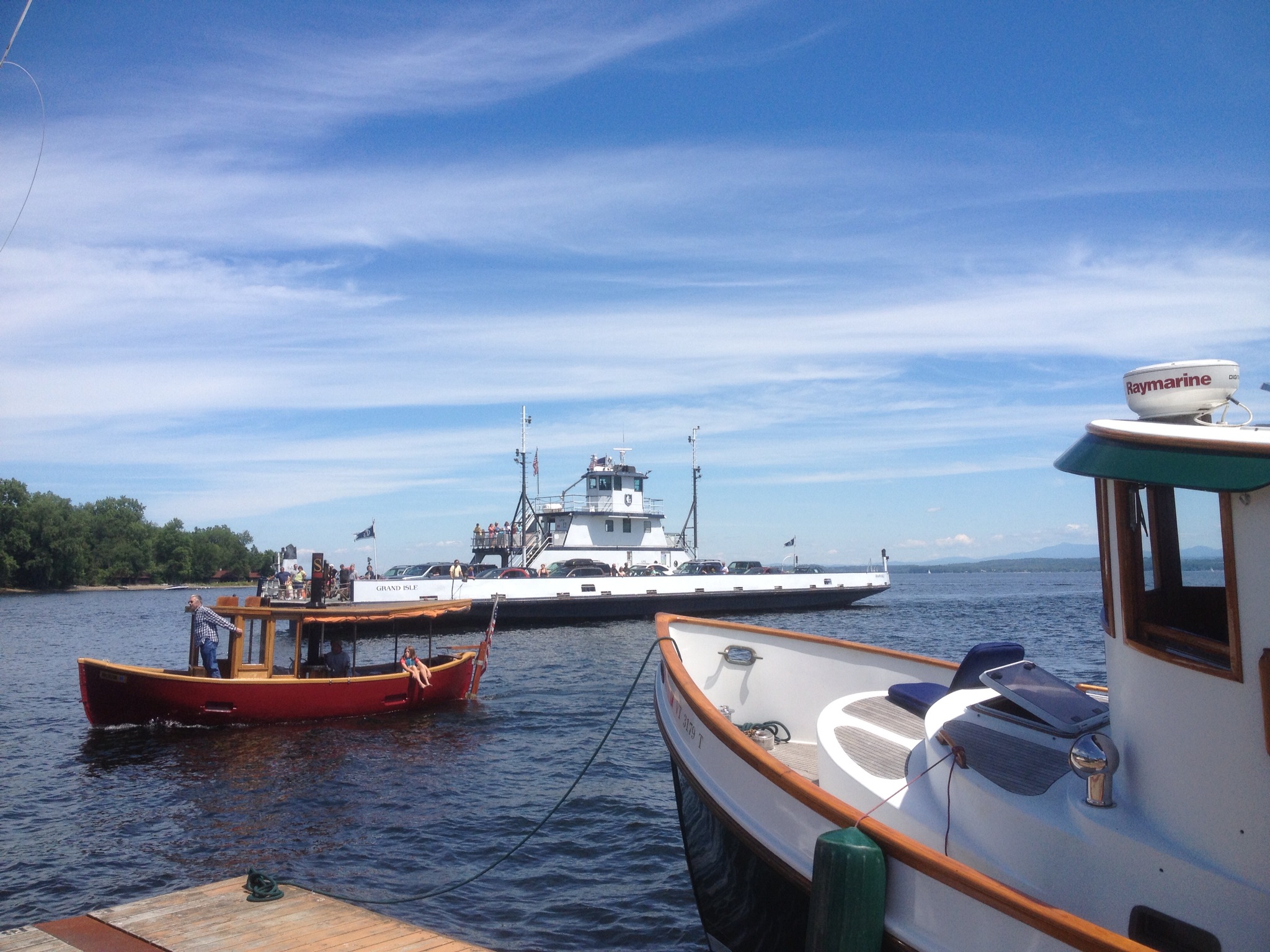 Tugboats playing on Lake Champlain between the Old Dock Restaurant in Essex, NY and the busy ferry dock.