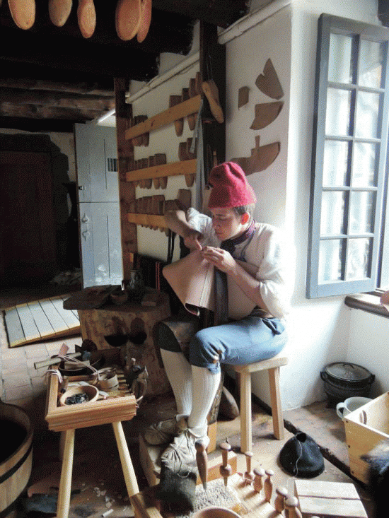A shoemaker works in Fort Ticonderoga’s Historic Trades Shop.