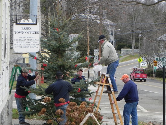 The Essex Highway Department decorates the Town Christmas tree