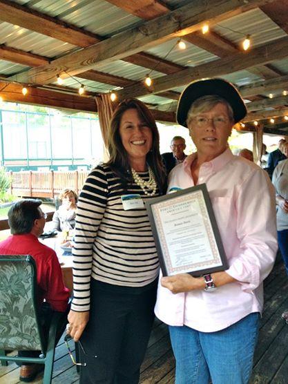 Volunteer Bonnie Sheeley receiving an award at the Annual Volunteer Reception, standing beside Fort Ticonderoga’s President and CEO, Beth Hill. (Credit: Fort Ticonderoga)