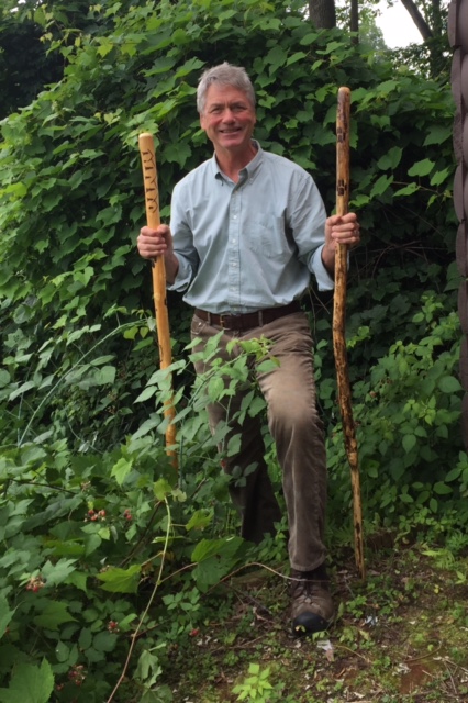 Chris Maron displaying two of the walking sticks created by Don Rennell. (Credit: CATS)