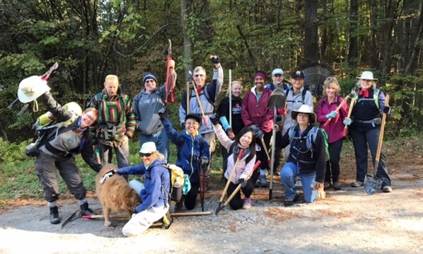 Thirteen Volunteer Vacationers joined Trail Steward Bill Amadon (second from left) and his Abby-the-Golden-Retriever on a frosty Monday morning to create a new CATS trail. (Credit: CATS)