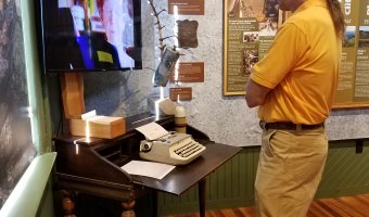 The Adirondack History Museum opened its new exhibit, “Hiking the Adirondack High Peaks” with a reception and ribbon cutting. The event reflects on the history and role hiking has played in the development of the Adirondacks. (Photo provided by Adirondack History Museum)