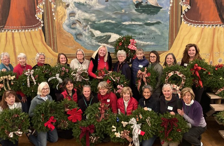 Members of the Adirondack Garden Club show wreaths made both for their own homes and for donations to Families First clients. (Photo by Lyn Flynn.)